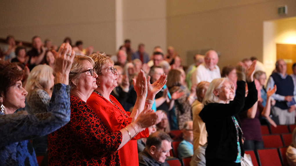 Audience applauding performance at the Jones Performing Arts Center (JPAC)