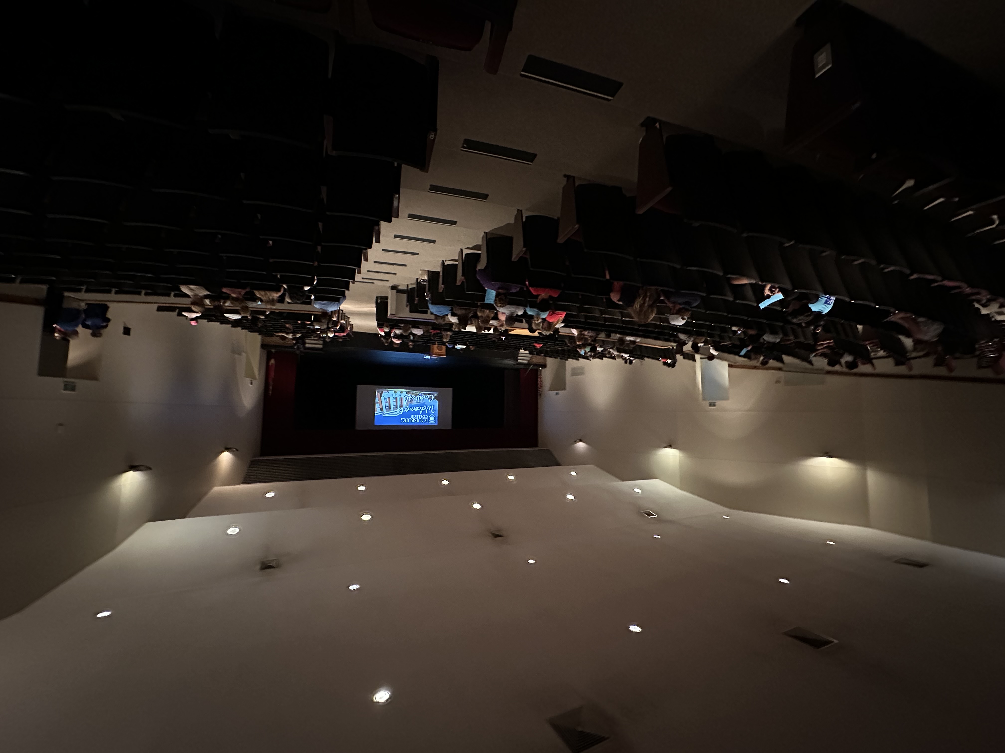 Wide angle view from back of auditorium.